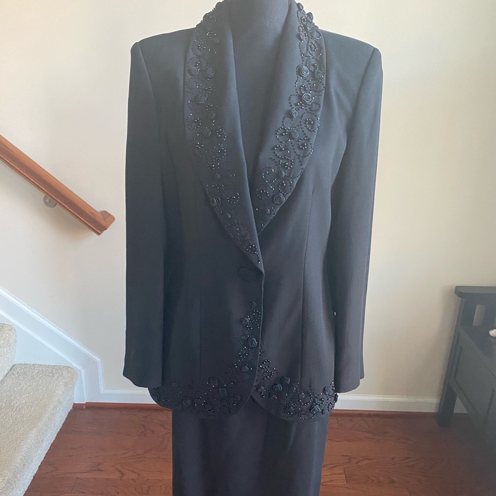 Black suit with mid length skirt
